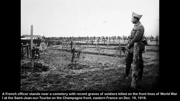 a french officer stands near a cemetery with
