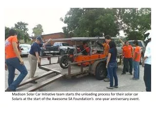 Madison Solar Car Initiative team starts the unloading process for their solar car