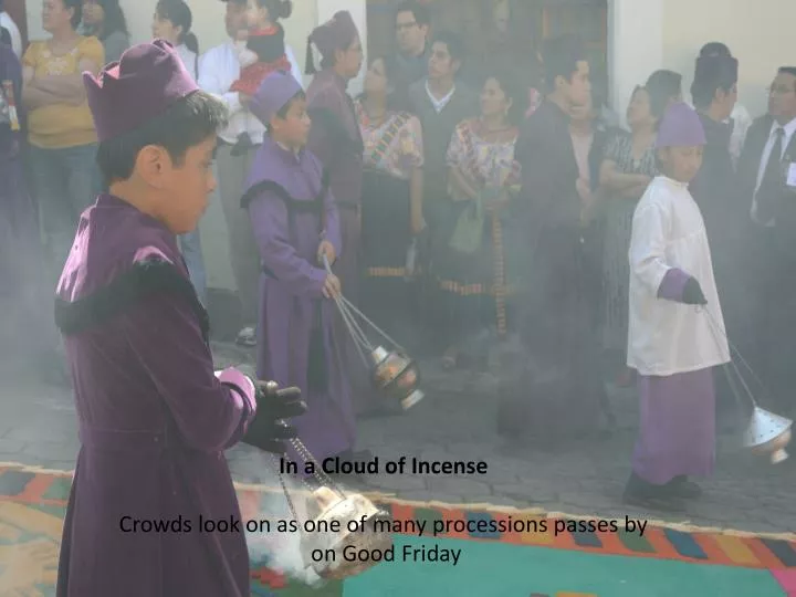 in a cloud of incense crowds look on as one of many processions passes by on good friday