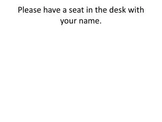 Please have a seat in the desk with your name.