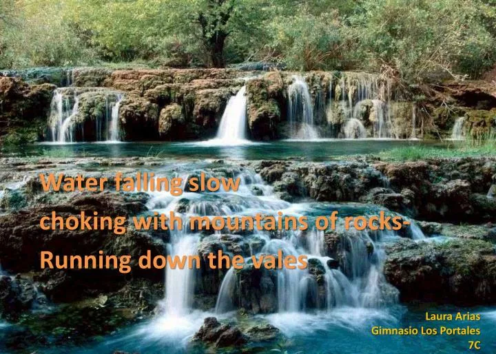 water falling slow c hoking with mountains of rocks running down the vales